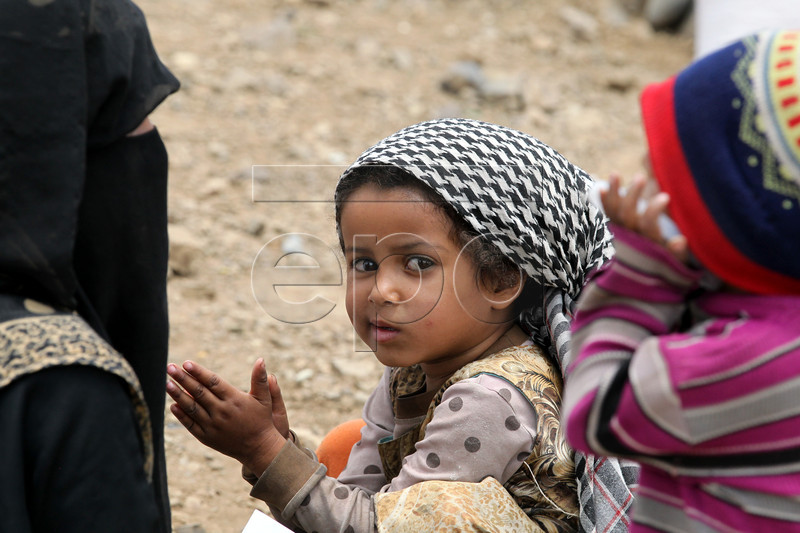 epa07550013 Displaced Yemeni children wait to receive food rations provided by Mona Relief Yemen ahead of the holy fasting month of Ramadan at a camp for Internally Displaced Persons (IDPs) on the outskirts of Sana'a, Yemen, 05 May 2019. A four-year long conflict in Yemen has created the worst humanitarian crisis in the world, where some 80 percent of Yemen's 26-million population are in need of humanitarian assistance. Muslims around the world celebrate the holy month of Ramadan by praying during the night time and abstaining from eating, drinking, and sexual acts during the period between sunrise and sunset. Ramadan is the ninth month in the Islamic calendar and it is believed that the revelation of the first verse in Koran was during its last 10 nights.  EPA-EFE/YAHYA ARHAB